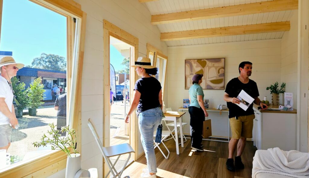 Attendees inside Corsica At Brisbane Tiny Homes Expo